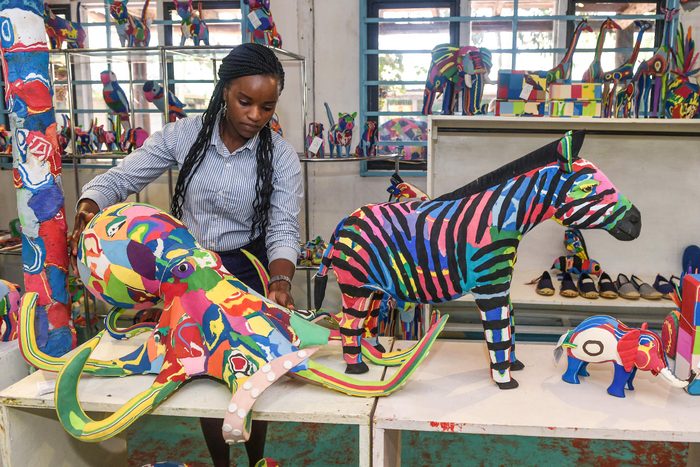 Grace Wangare, executive accountant, displays a finished toy octopus made from pieces of discarded flip-flops, at the Ocean Sole flip- flop recycling company shop in Nairobi, Kenya on February 09, 2022.