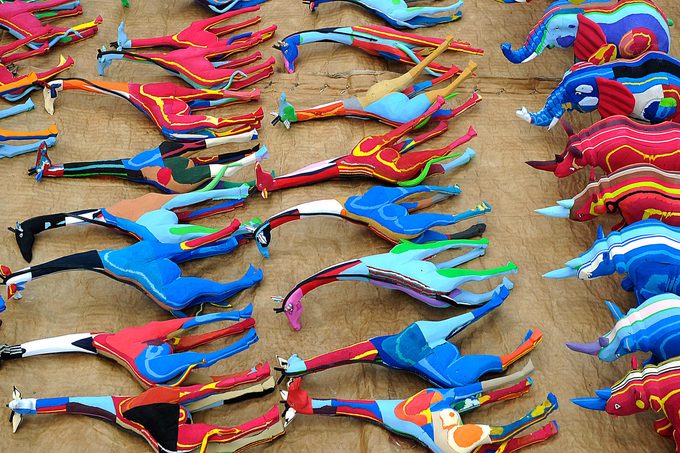 Finished toy giraffes and rhinos made from pieces of discarded flip-flops are drying in the sun after being washed on November 18, 2013 at the Ocean Sole flip-flop recycling company in Nairobi, Kenya.