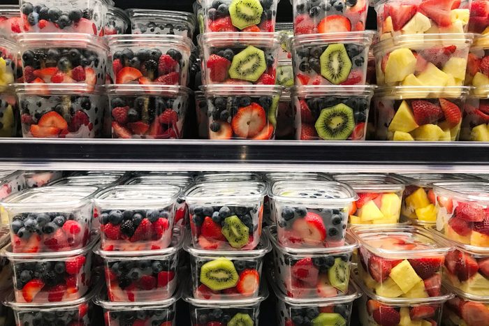 Fresh cut fruit in plastic containers in the grocery store