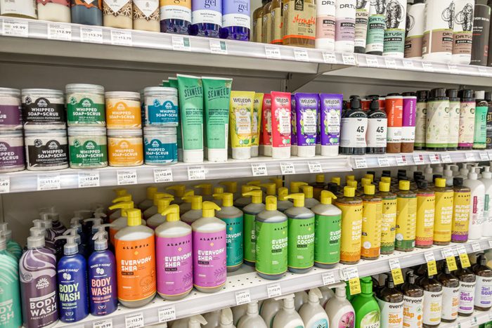 shampoo and soap aisle at a grocery store with stocked shelves
