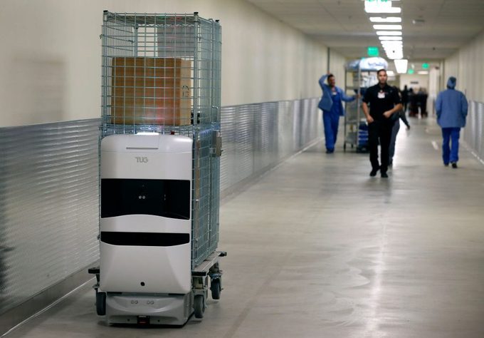 A Tug autonomous mobile robot delivers supplies at the Stanford Medical Center in Stanford, Calif. on Tuesday, Nov. 26, 2019. Twenty-three of the robots will be joining a fleet of five already in service to deliver supplies and linen throughout the sprawl