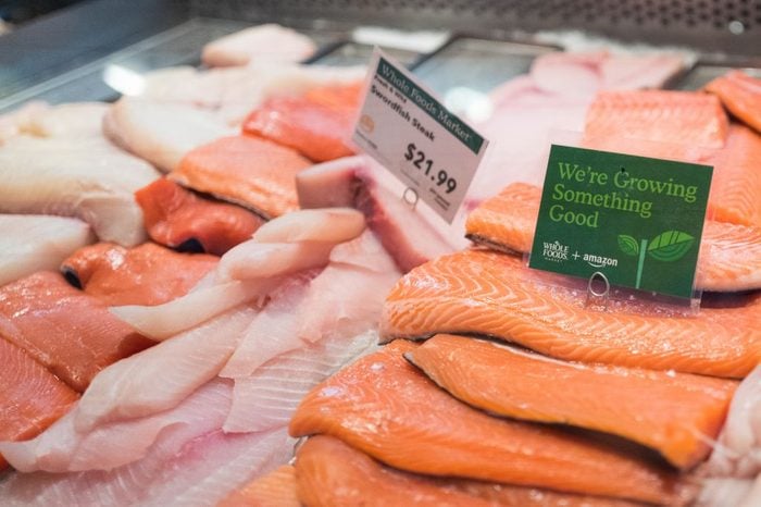 Signage on a display of fresh salmon at the Whole Foods Market store in Lafayette, California
