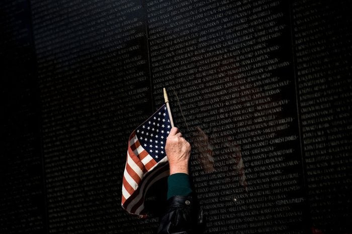 A man points to a name while visiting the Vietnam War Memorial on Veterans Day November 10, 2017 in Washington, DC