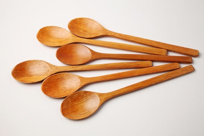 High Angle View Of Wooden Spoons Against White Background
