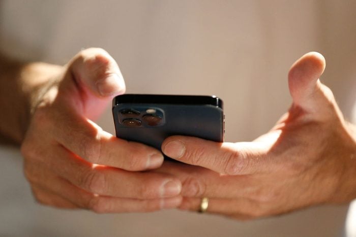 close up of hands holding a phone