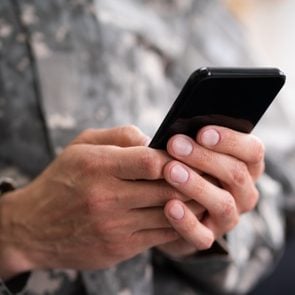 Army Soldier Using Phone and scamming