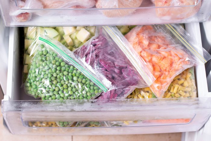 Assortment of frozen Vegetables in fridge. Frozen food in the freezer