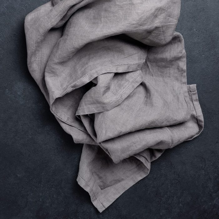 used grey linen napkin on a steakhouse restaurant table