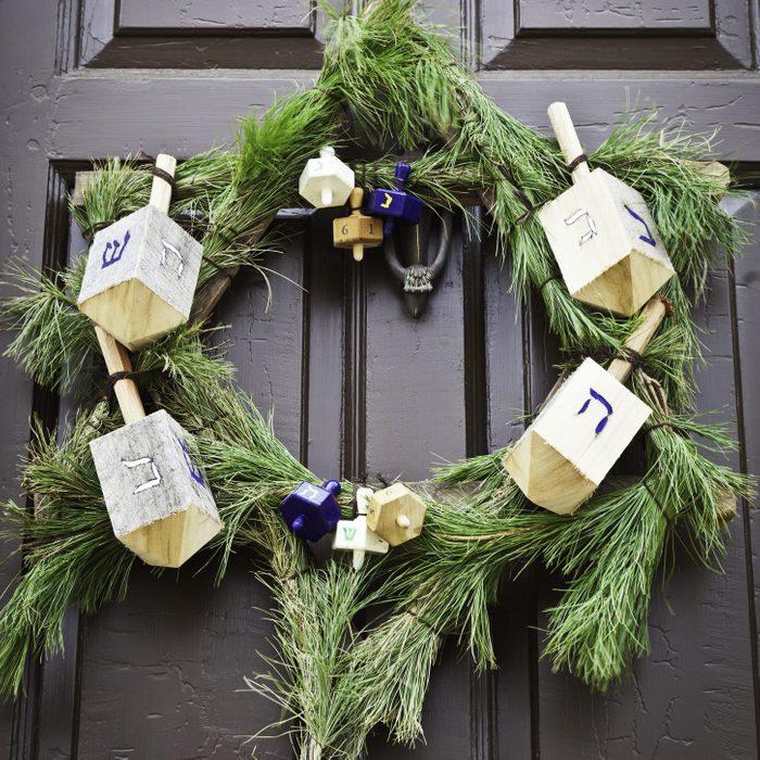 Rustic Holiday Wreath with driedels in the shape of the star of david for Hannukah on Front Door
