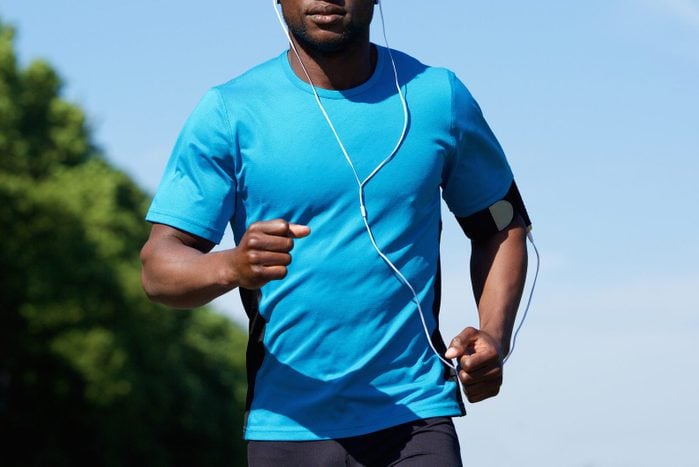 Fit young african american man running outdoors