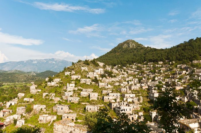 abandoned buildings across the hillside in Kayakoy, in the Fethiye Peninsula, on the Aegean coast.
