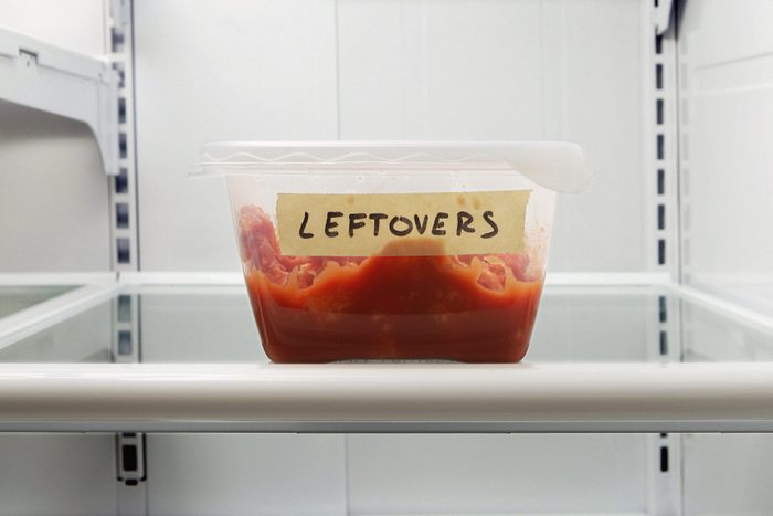 Single leftover container on refrigerator shelf