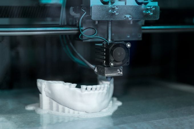 medical 3d printer printing a jaw with teeth