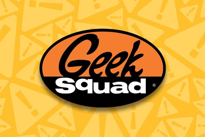 geek squad logo with yellow warning symbols in the background
