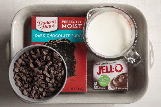 4-Ingredient Chocolate Dump Cake ingredients styled inside the baking pan