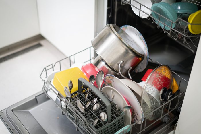Dishwasher full with dishes in kitchen
