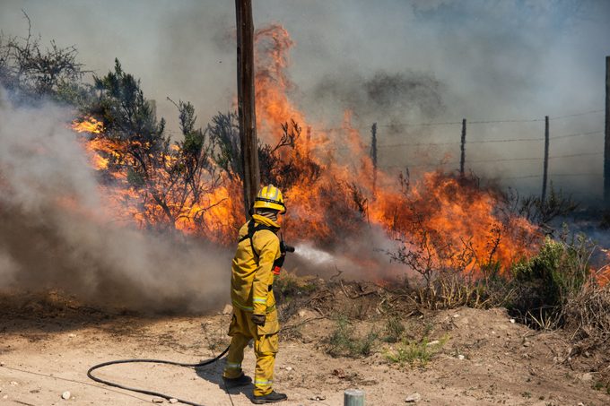 firefighter putting out a wildfire in California