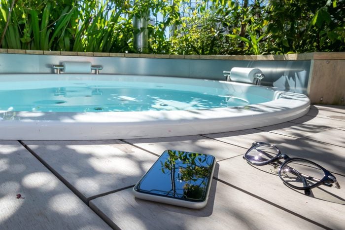 outdoor bath with smart phone and glasses
