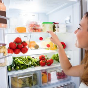 Woman Searching For Food In The Fridge