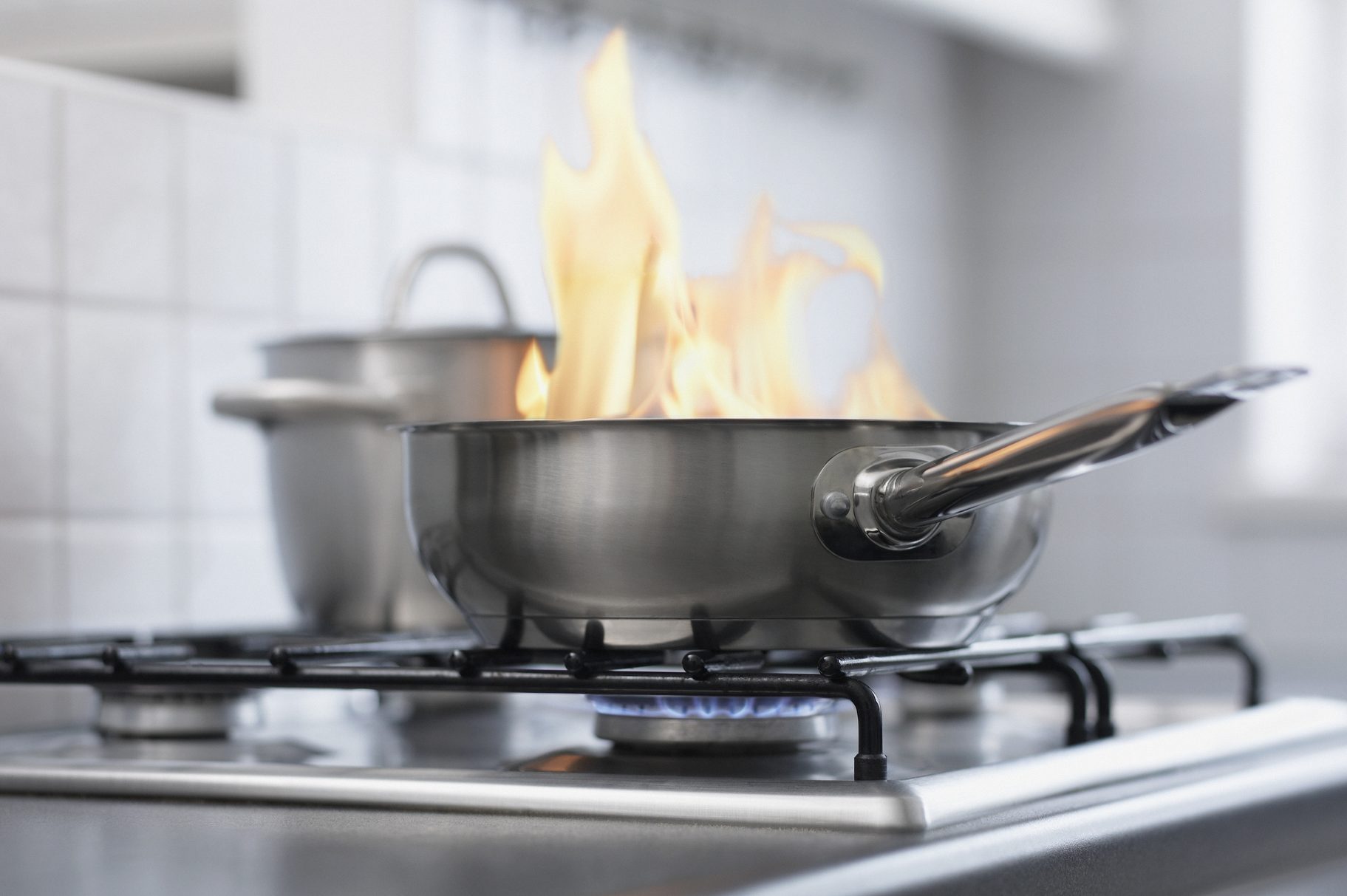Food burning in pan on stove