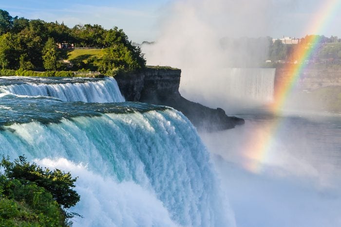 Early Morning on American side of Niagara Falls with a rainbow over the Canadian side