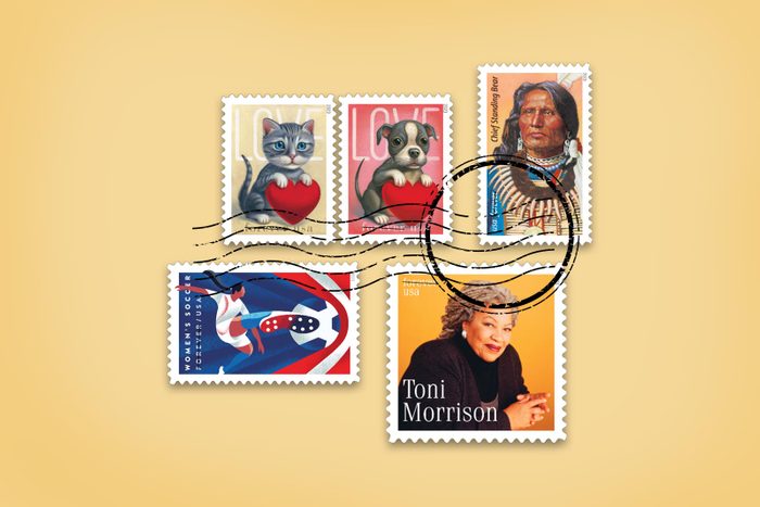 five different New USPS stamps for 2023 on a manila envelope yellow background