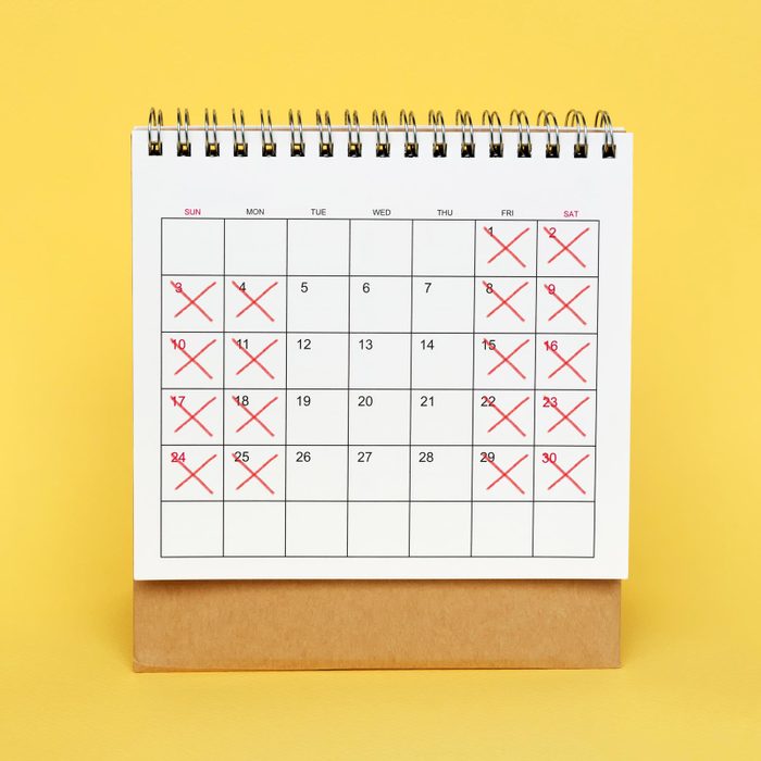 calendar on a yellow background with red "x" on 4 days of each week