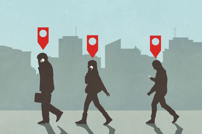 illustration of Map pin icons above business people walking and talking on smart phones in city