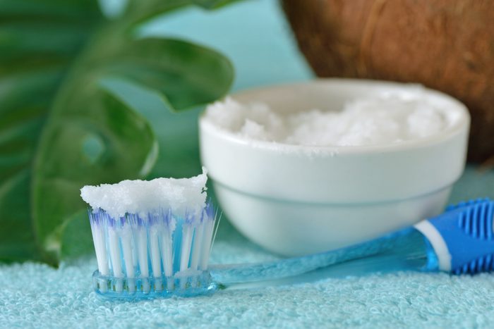 Close-Up Of Baking Soda And Toothbrush On Table