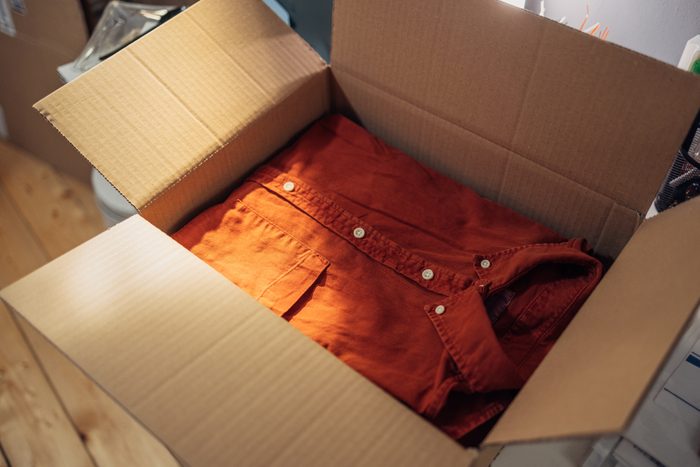 Close up Shot of a Red Shirt in a Cardboard Box