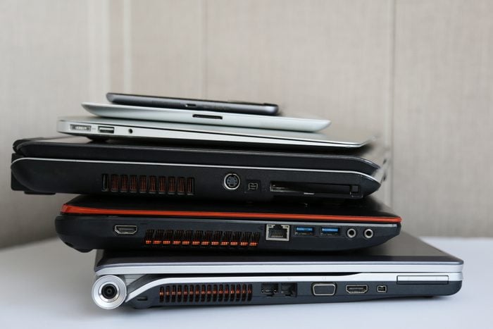 Stack of Laptops And Tablets Ready For Recycling
