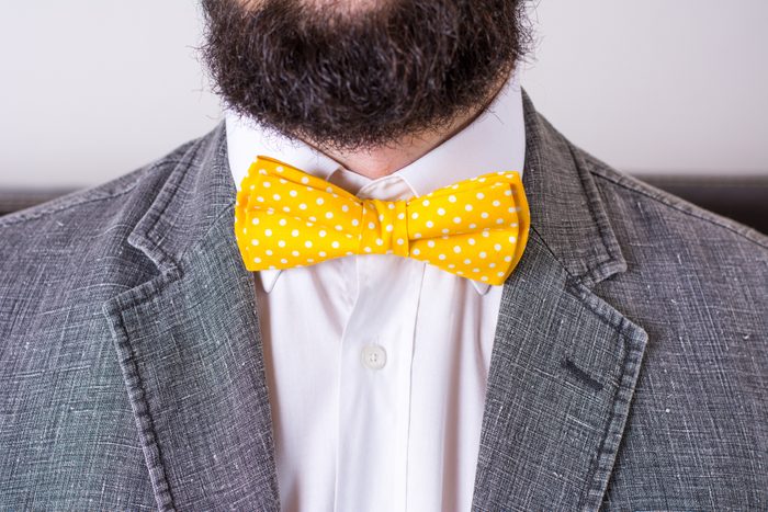 Bearded man in a suit and bow tie