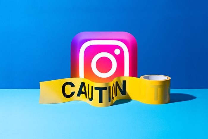 3D instagram app logo with caution tape in front