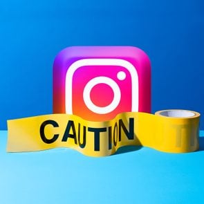 3D instagram app logo with caution tape in front