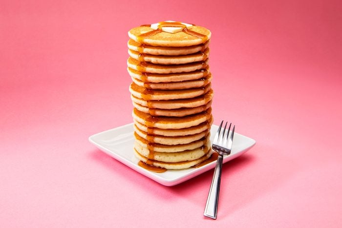 Big Tall Stack Of Pancakes On Pink Background