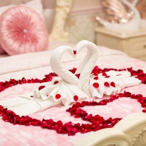two towel swans shaped on the bed,Honey moon bed.Honeymoon