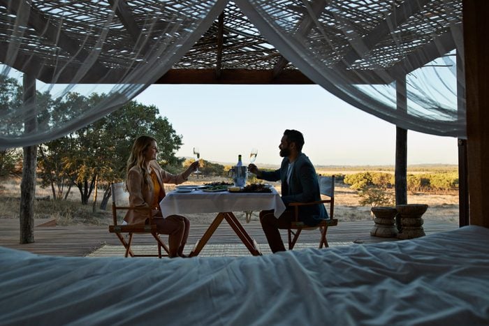 Couple having private romantic dinner in luxury cabin