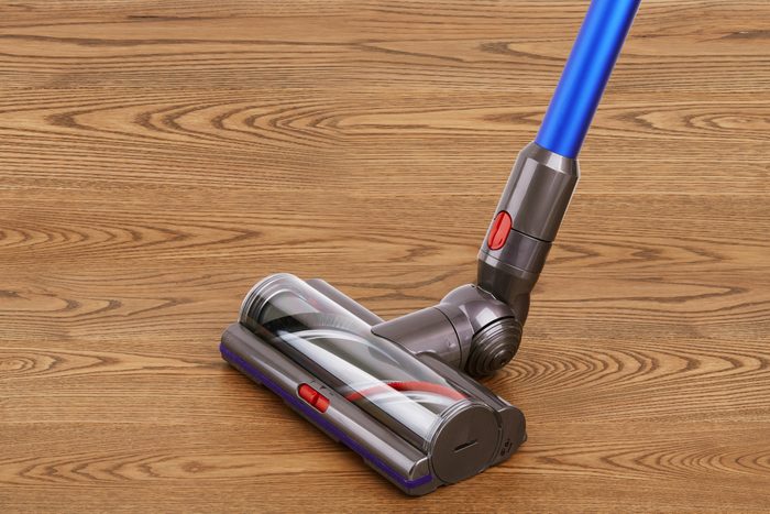 Motorized Head of modern vacuum cleaner on a wooden floor
