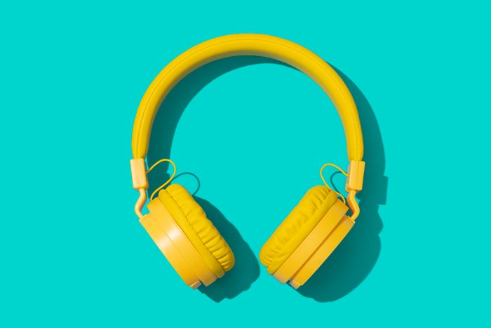 Yellow headphones on a green background