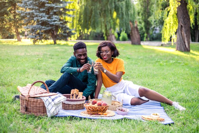 Young black couple on picnic in the park.