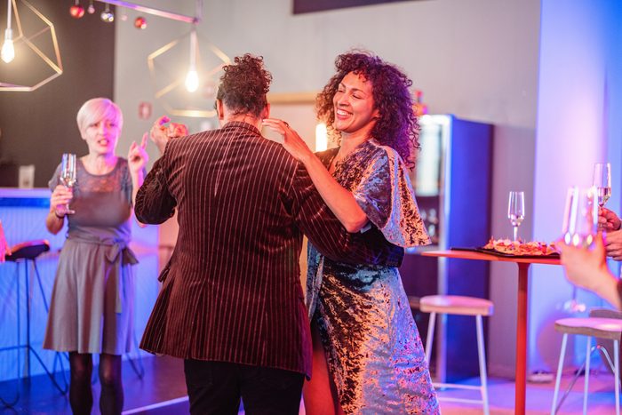 Happy Mature Hispanic Couple Dancing At A Party