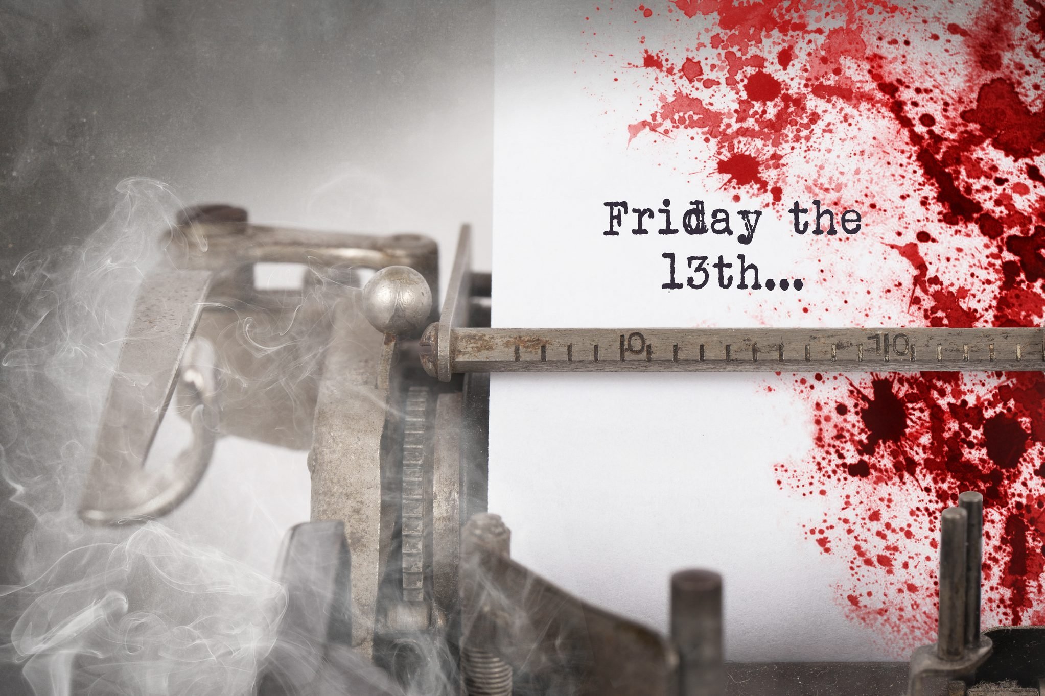 Bloody note on a typewriter that says "Friday the 13th..."