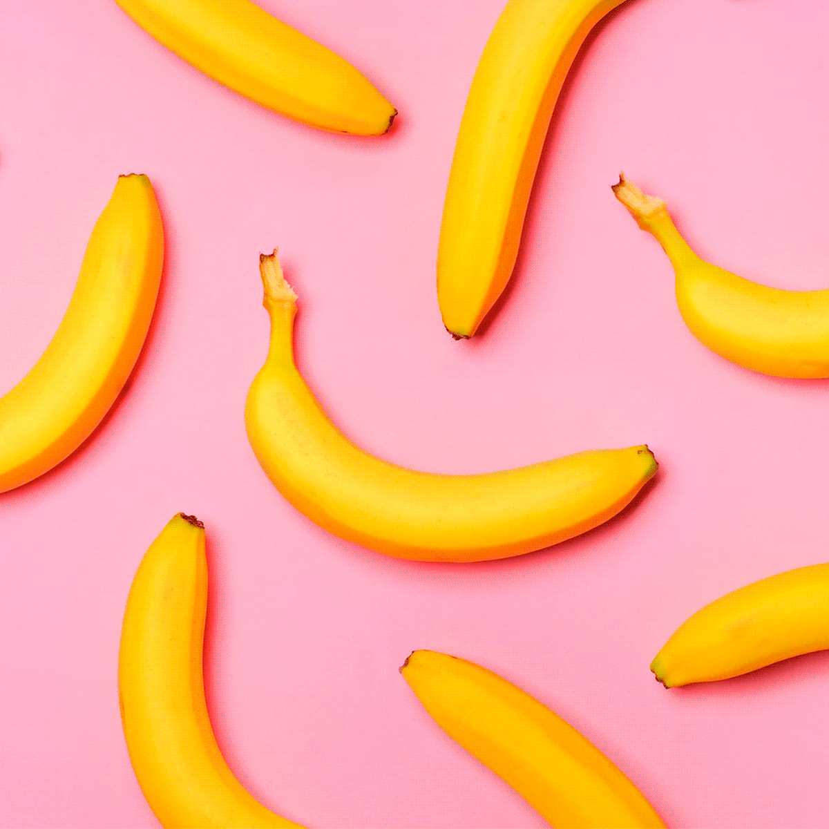 Banana moving back and forth on a pink background