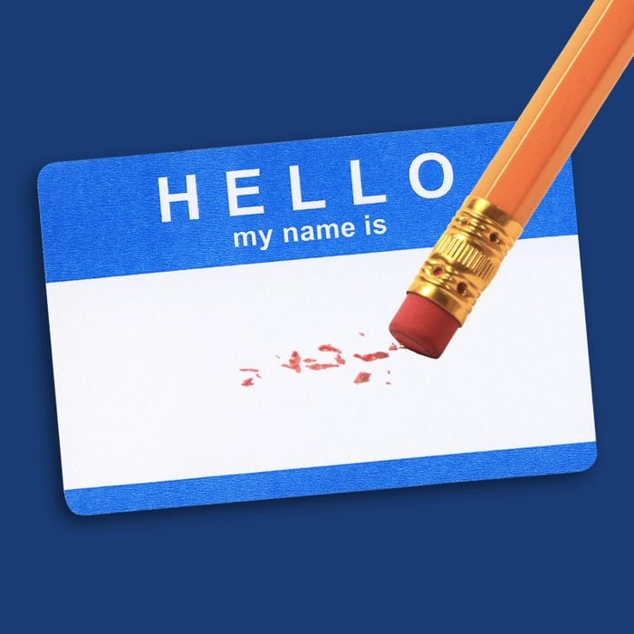 Blank blue name tag with pencil eraser shavings