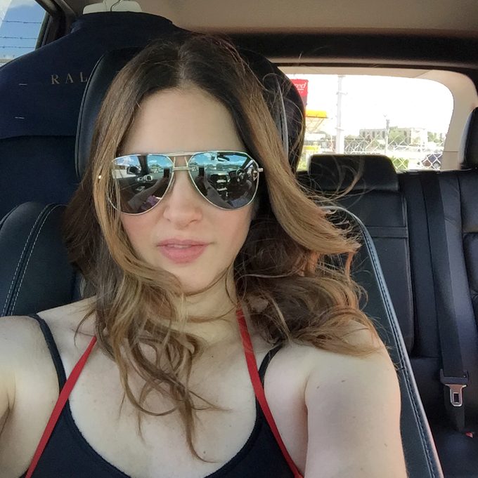 woman on a road trip wearing sunglasses