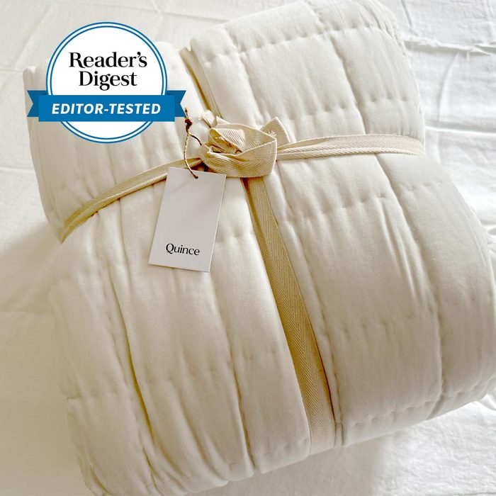 cream colored Quince Bedding wrapped with a ribbon