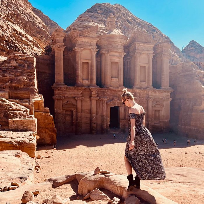 woman walking exploring ancient remains