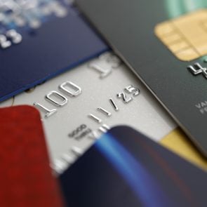 Stack of multicolored credit cards on a black background