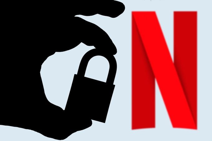 hand seen holding a padlock with Netflix Logo beside it