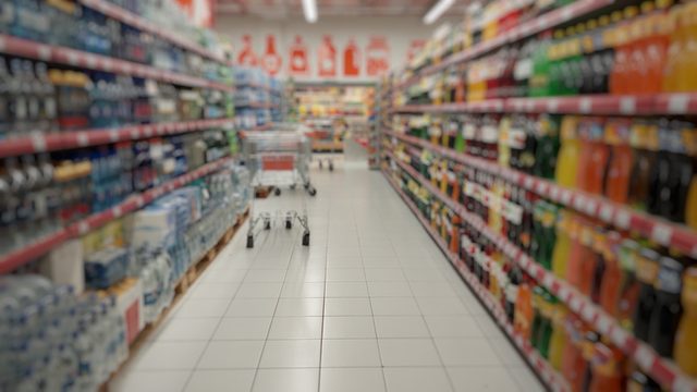 Blurry unfocused background of goods in the supermarket